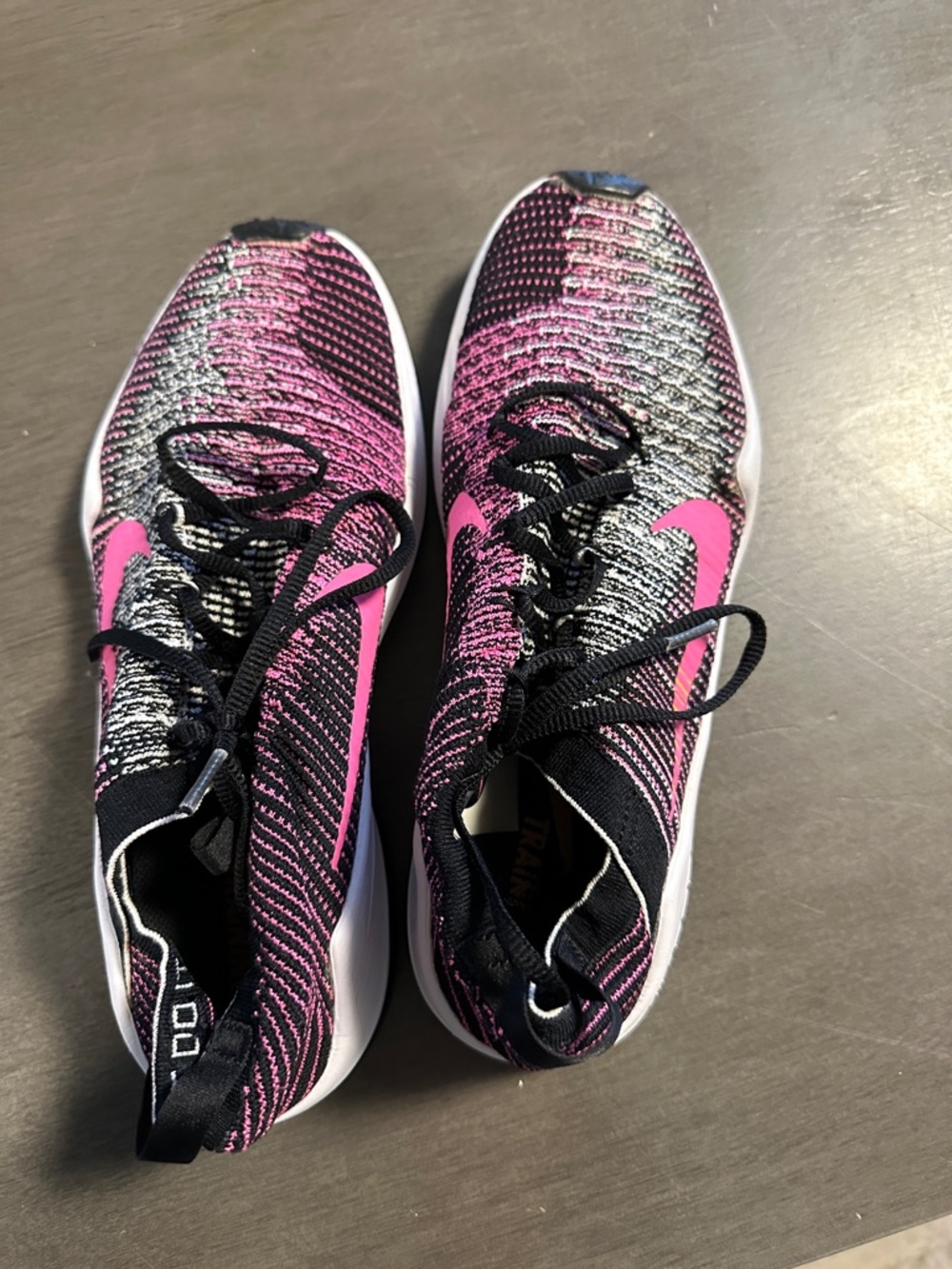 Nike Women’s Black and Pink Flyknit Athletic Sneakers